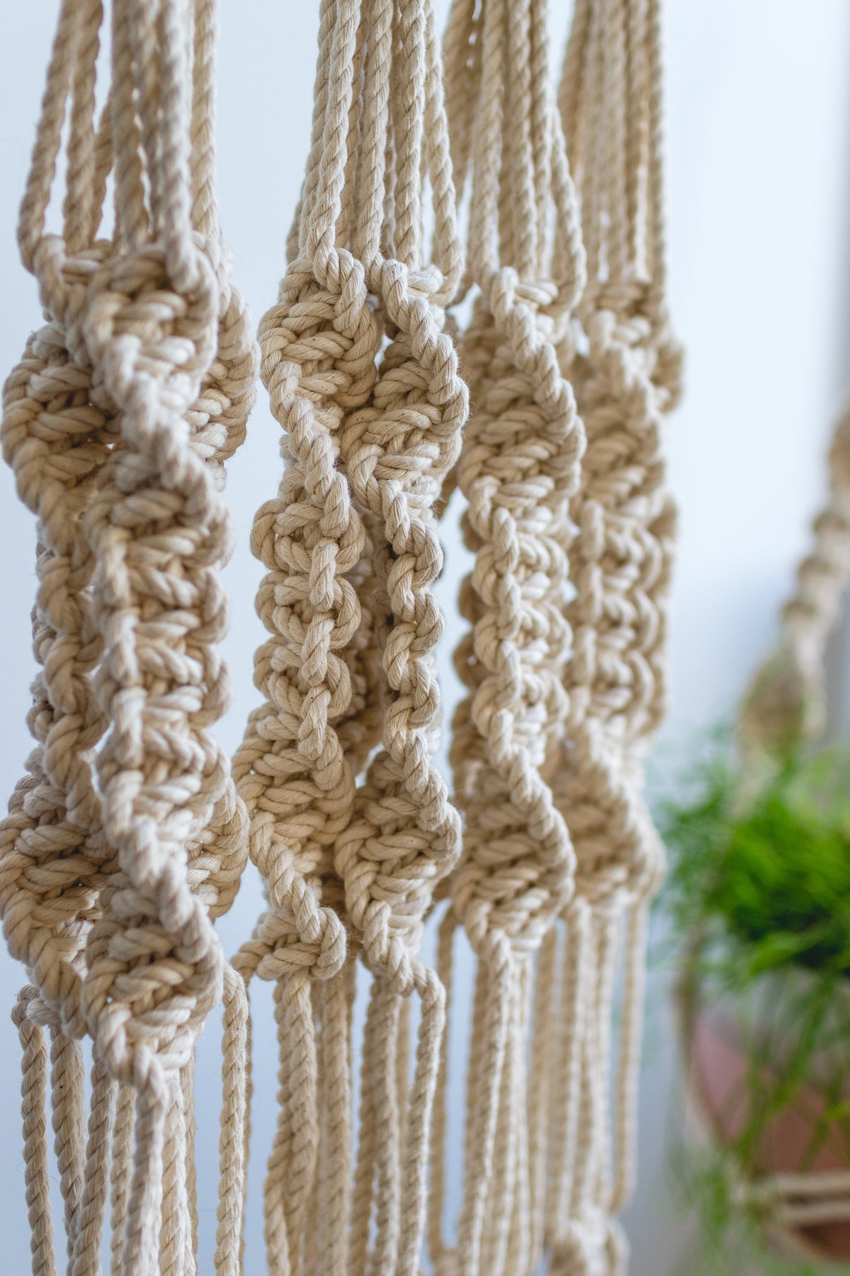 Macrame plant hanger 40&quot; in length with Blue and Gray details.